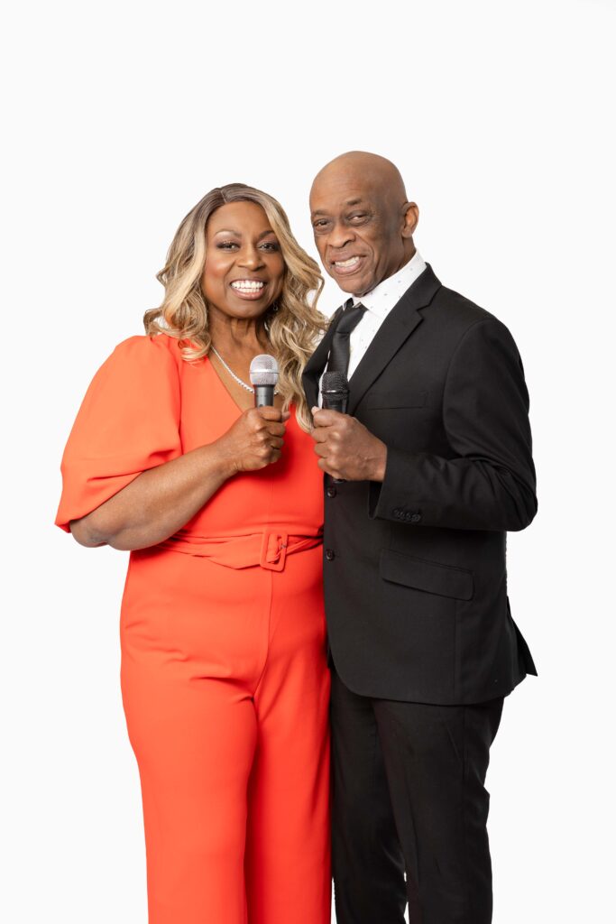 Denise Carter wearing a red-orange jumpsuit and husband Wills posing in studio, including lifestyle and podcast-style images with microphone.