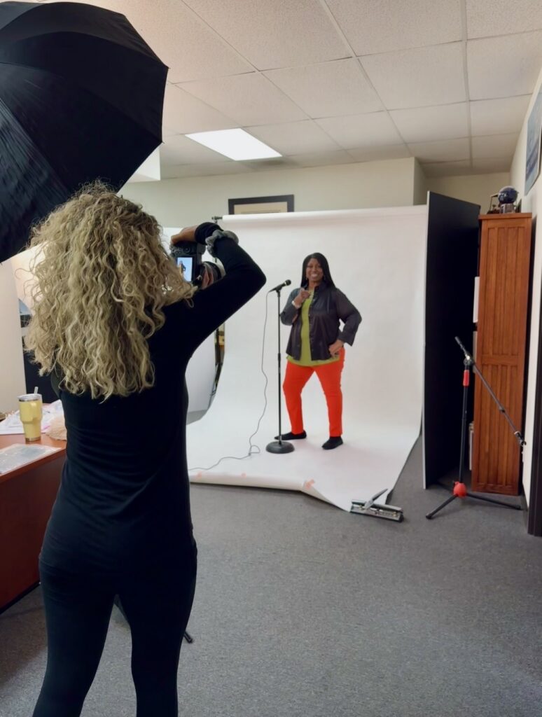 Behind-the-scenes images of Denise Carter’s brand photoshoot with studio lighting and white backdrop setup in an office space.